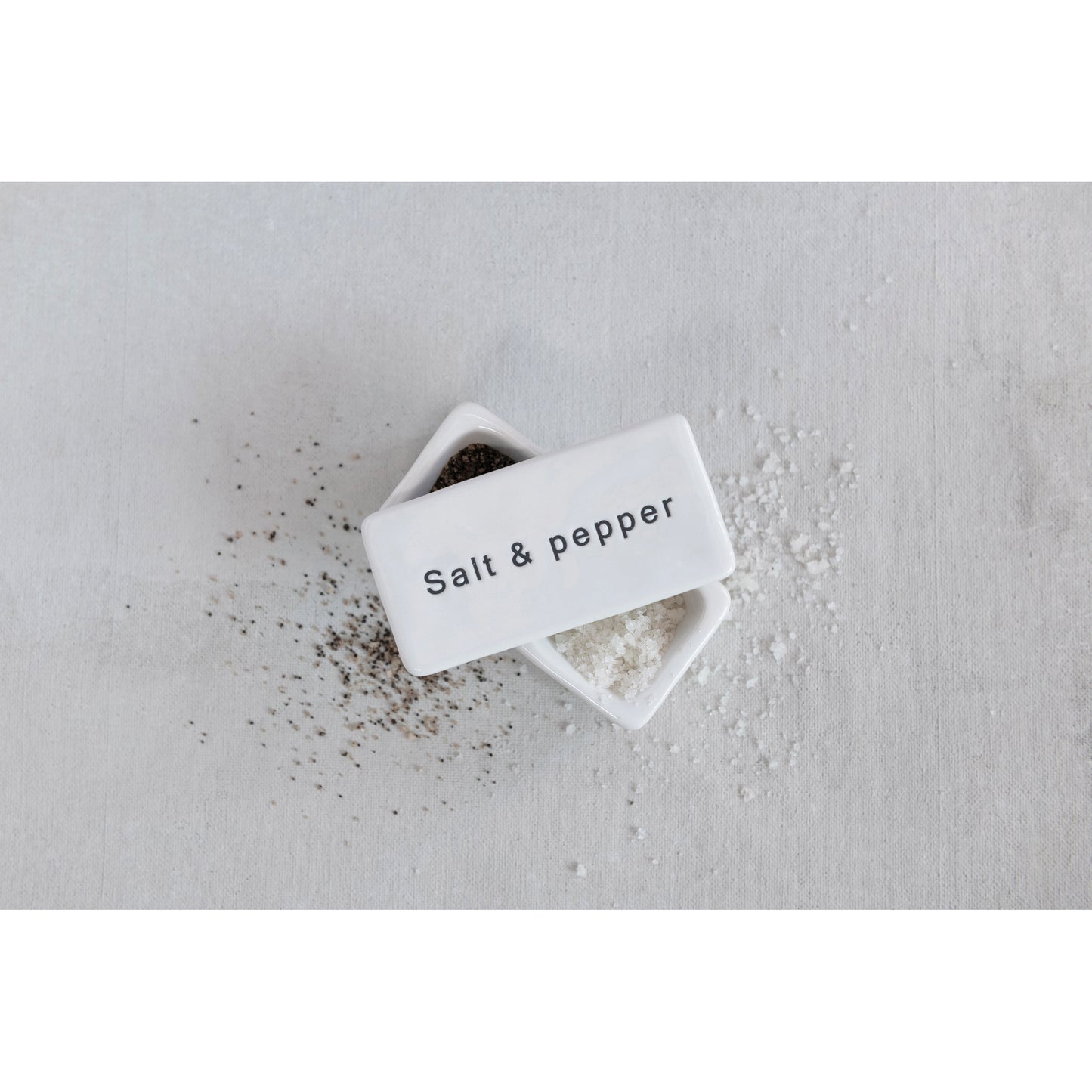 White stoneware salt and pepper pinch pot with lid and two compartments