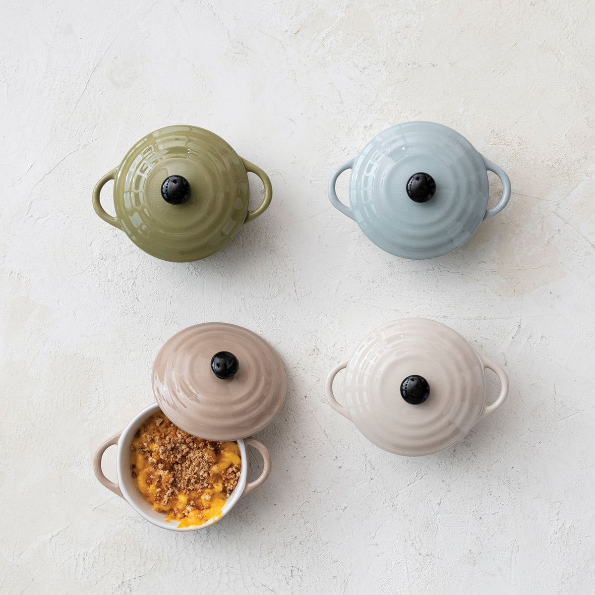 Stoneware mini cocottes with lids in sage green powder blue mocha and cream
