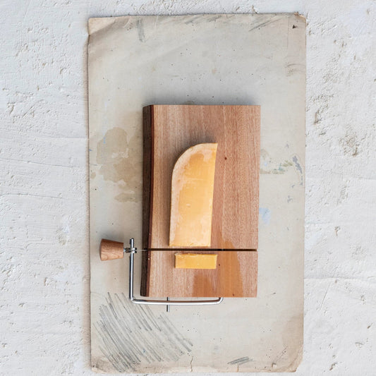 Live edge mahogany wood cheese slicer with natural bark edge and stainless steel wire
