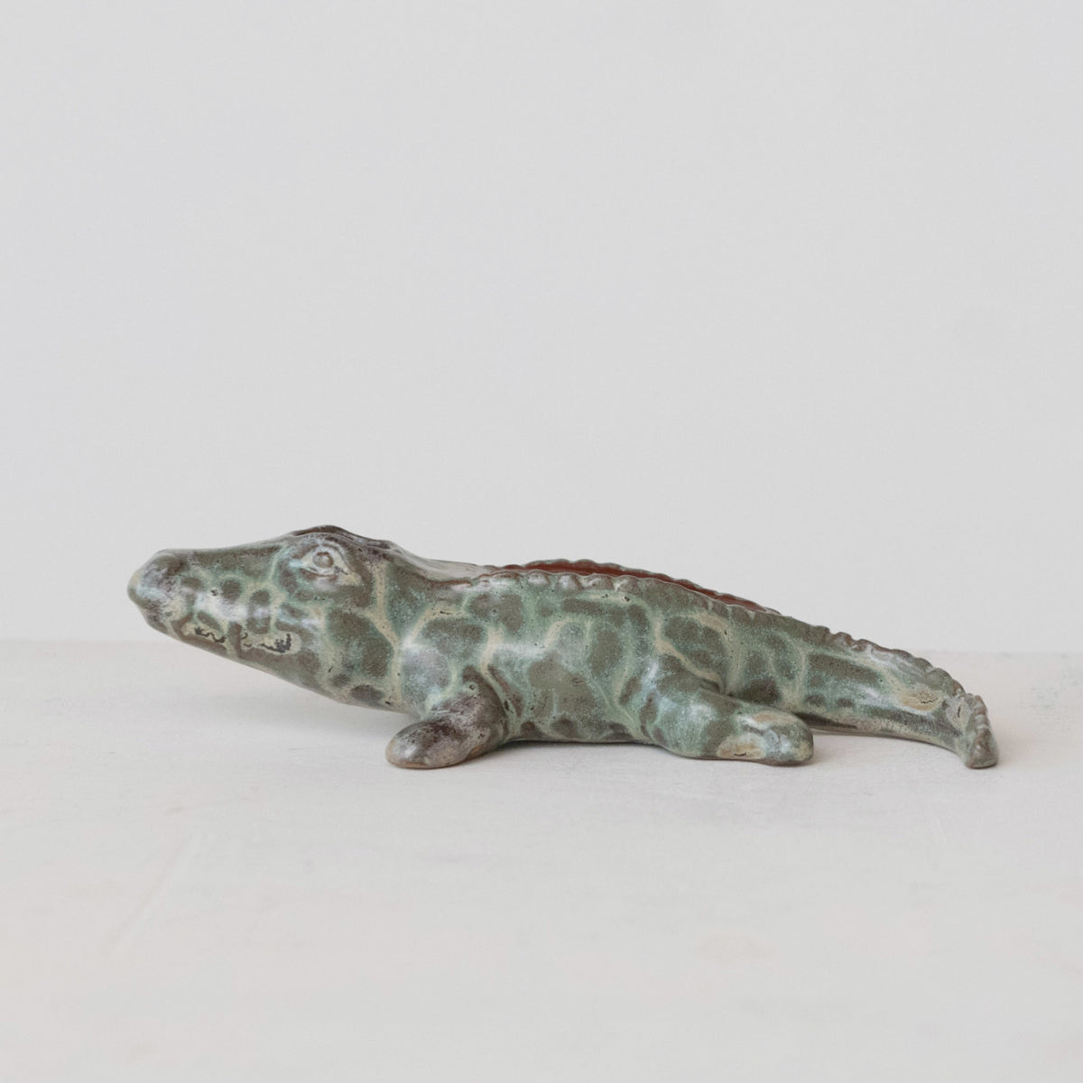 Green stoneware alligator match holder with built-in striker and reactive glaze