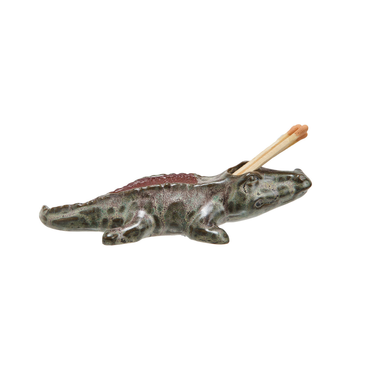 Top view of Bayou alligator match holder showing match opening and striker
