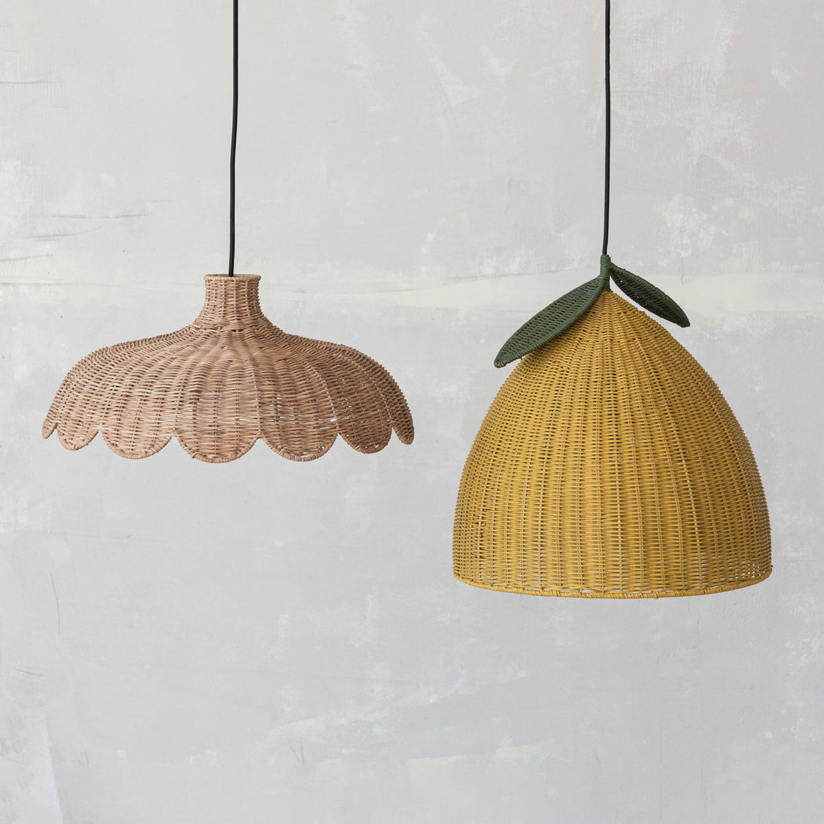 Yellow lemon and scalloped rattan pendant lights styled together as whimsical woven hanging lighting
