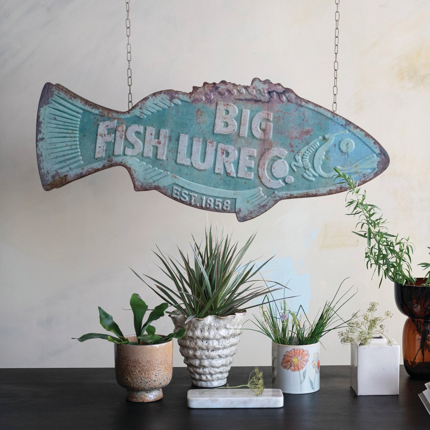 Big Fish Lure Co vintage metal fish wall sign hanging in rustic lake house decor