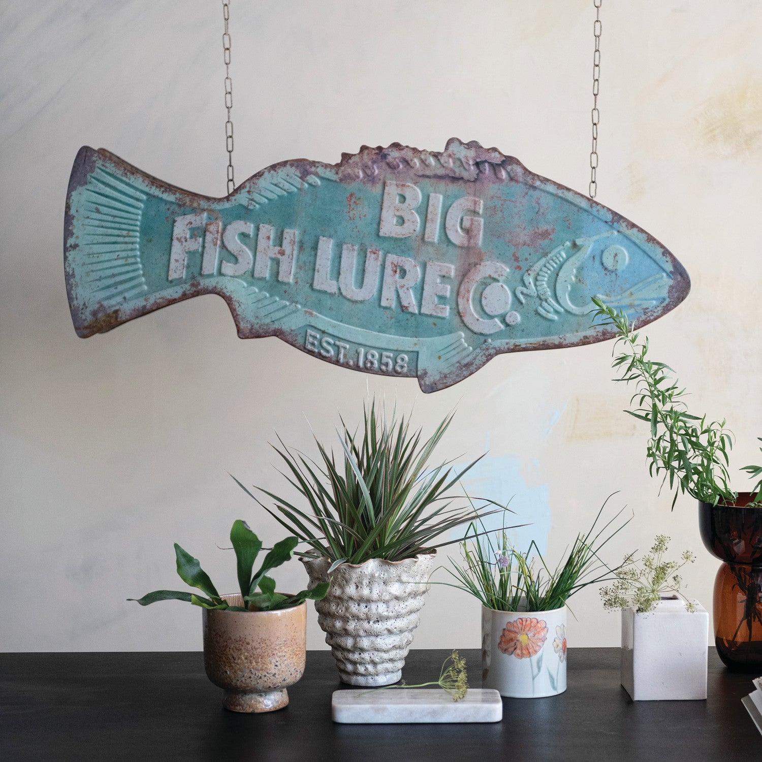 Big Fish Lure Co vintage metal fish wall sign hanging in rustic lake house decor