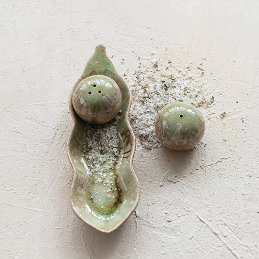Peas in a pod stoneware salt and pepper shakers styled on a kitchen table