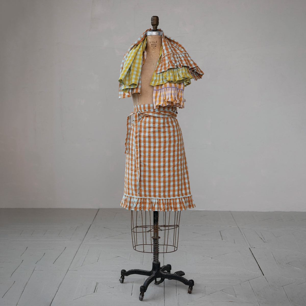 Brown and soft blue gingham cotton half apron with ruffled hem and waist ties