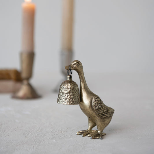 Vintage-inspired antique gold duck candle snuffer displayed with taper candles

