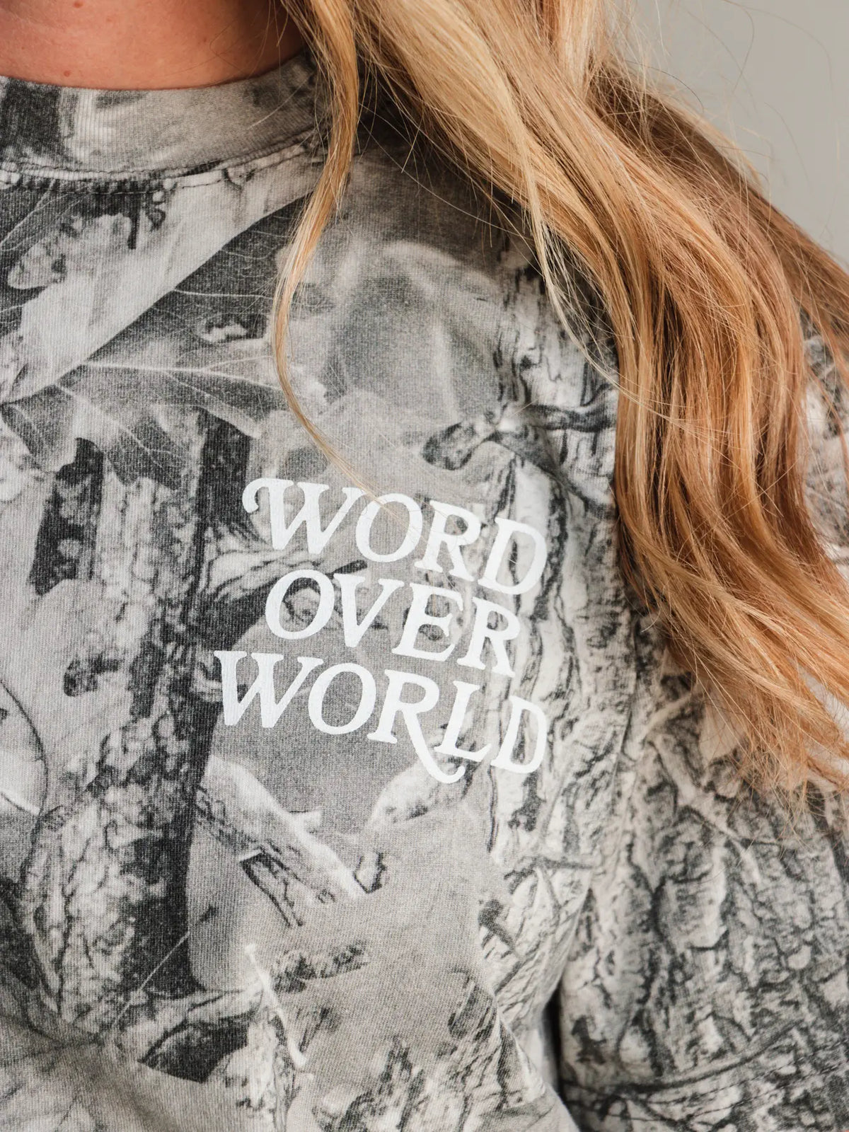 Word Over World front graphic on grey woodland camo Christian T-shirt