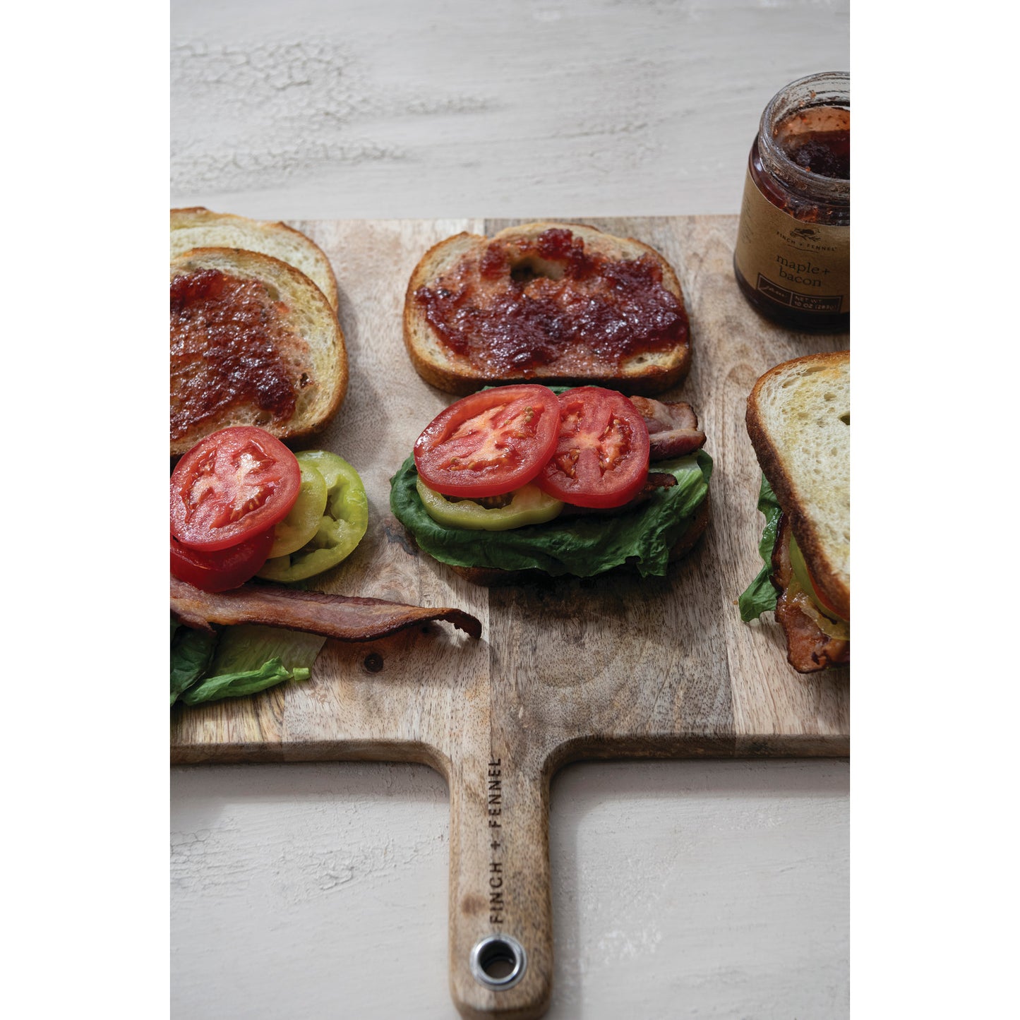 Finch + Fennel Maple Bacon Jam served on BLT sandwiches with tomatoes, lettuce and bacon