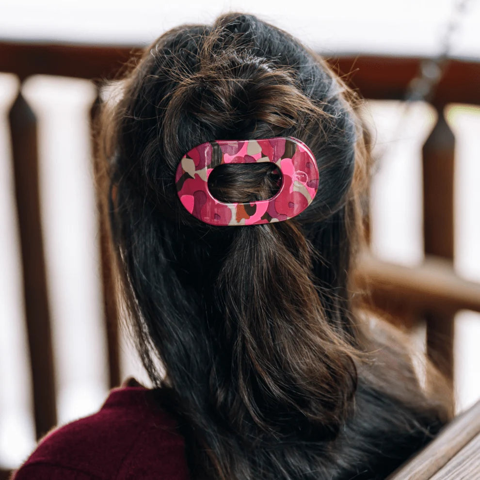 TELETIES Garden Glam flat back floral hair clip styled in dark hair

