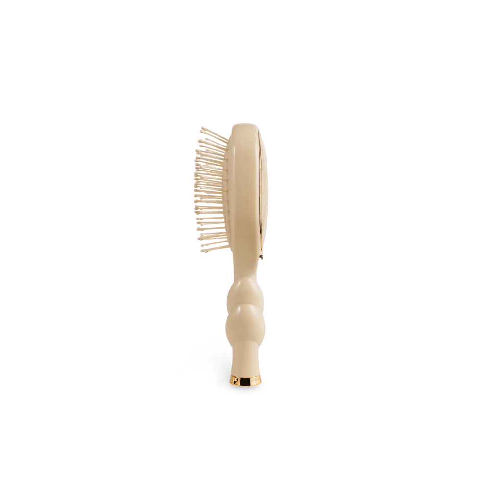 Side view of TELETIES Mini Detangler travel hair brush in Tan
