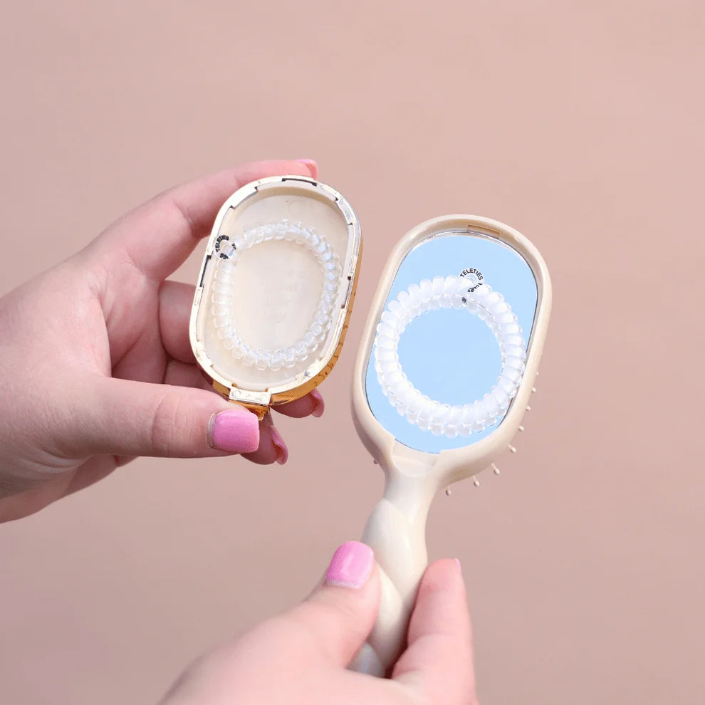 TELETIES Tan Mini Detangler Hair Brush with built-in mirror and hair tie storage