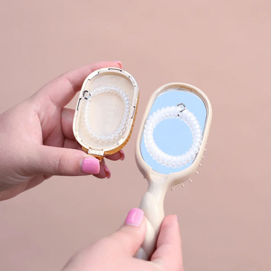 TELETIES Tan Mini Detangler Hair Brush with built-in mirror and hair tie storage