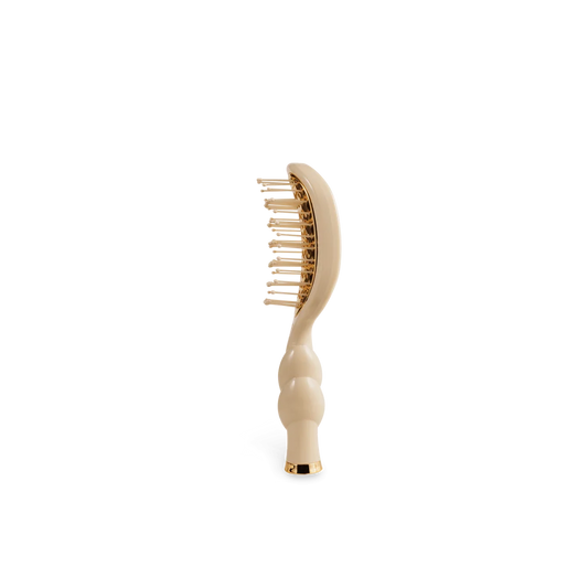 Side view of TELETIES Mini Vented Hair Brush in Tan with anti-static bristles and gold accents