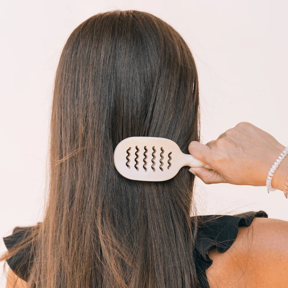 TELETIES Mini Vented Hair Brush in Tan smoothing brunette hair for quick everyday styling