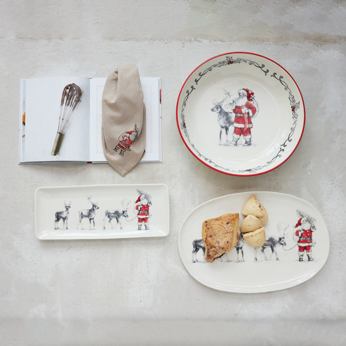 Vintage Santa Christmas oval serving platter styled with holiday baked goods and coordinating Christmas tableware